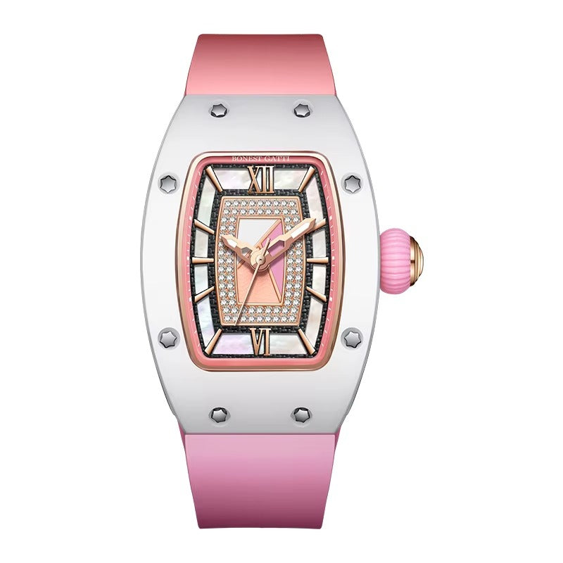 Luxury pink chronograph watch with diamond bezel, mother-of-pearl dial, and sporty rubber strap — motorsport-inspired design