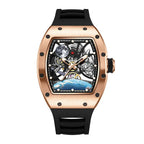 Luxury skeleton watch with a rose gold case, space-themed dial, and black rubber strap.