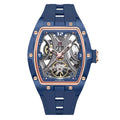 Blue tonneau-shaped skeleton automatic watch with visible movement, gold accents, sporty luxury style