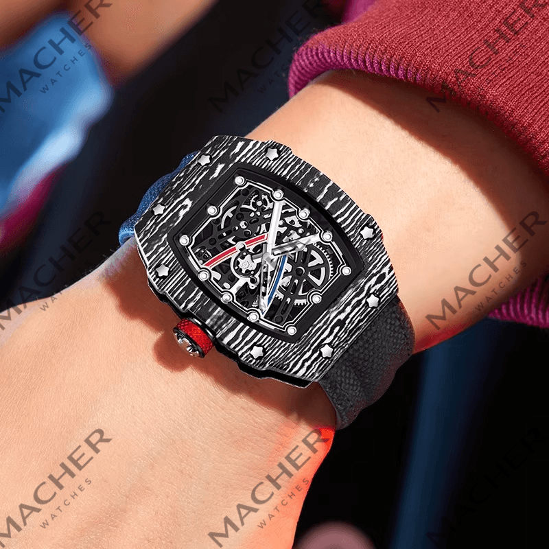 Carbon fiber skeleton watch with bold motorsport design, red crown, and sport-luxury style on wrist