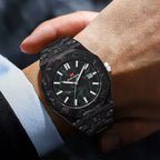 Luxury black carbon fiber watch with bold dial and date window on wrist, motorsport-inspired style