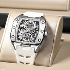 Luxury skeleton dial watch with bold steel case and white strap, motorsport-inspired design