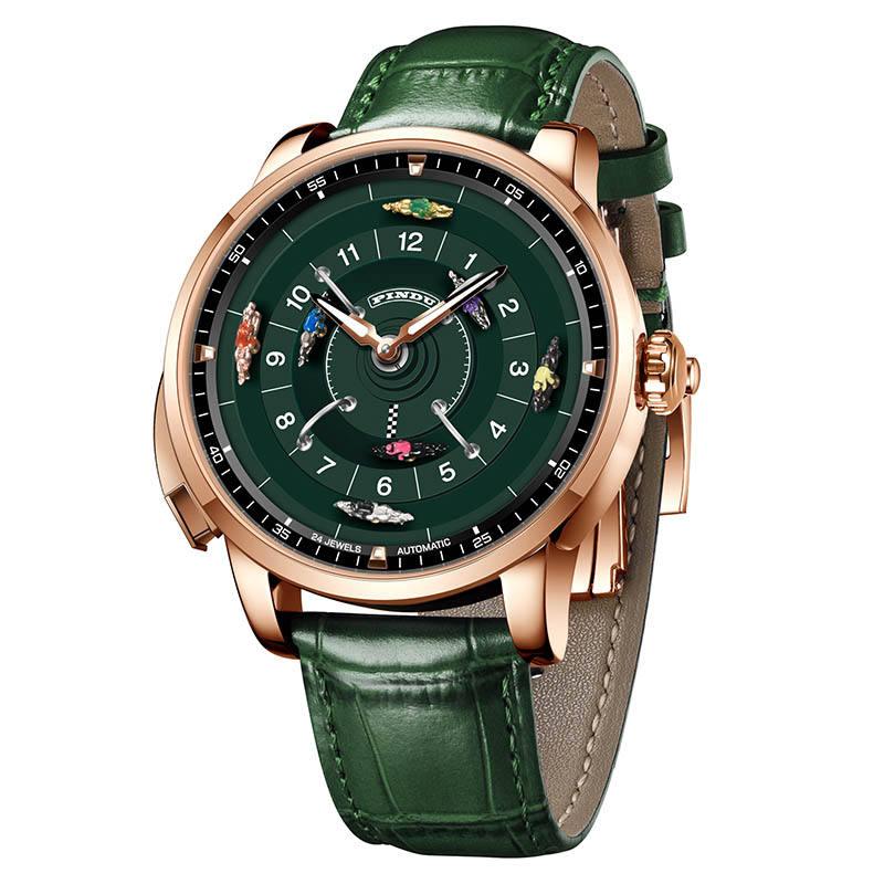 Racing-inspired luxury watch with green dial, gold case, miniature cars, and green leather strap