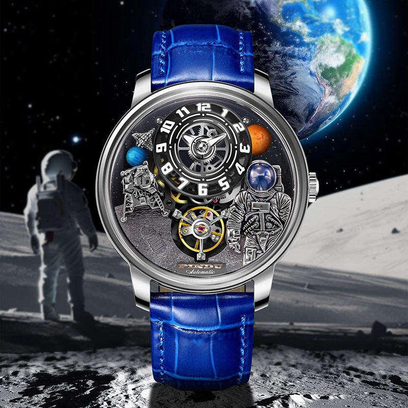 Luxury motorsport-inspired watch with astronaut and moon landing details, blue leather strap