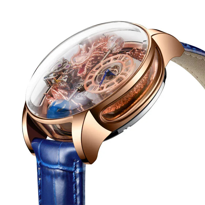 Luxury skeleton watch with rose gold case, intricate dragon detail, blue leather strap, and Roman numeral dial