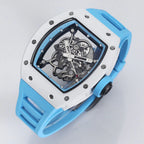 Luxury skeleton watch with white case, blue strap, and exposed mechanical movement, motorsport inspired