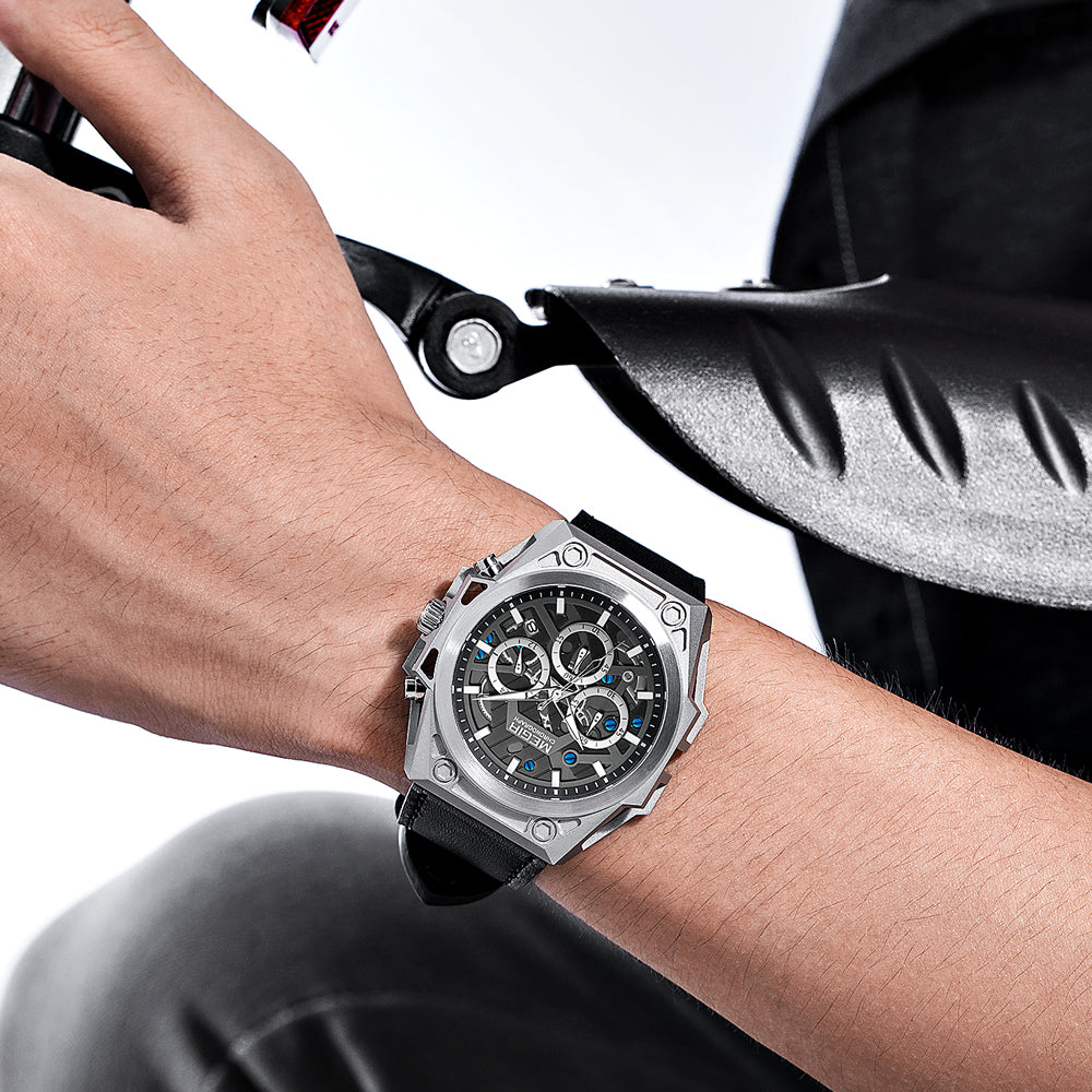 Luxury chronograph watch with bold design, carbon fiber case, and sporty black strap worn on wrist