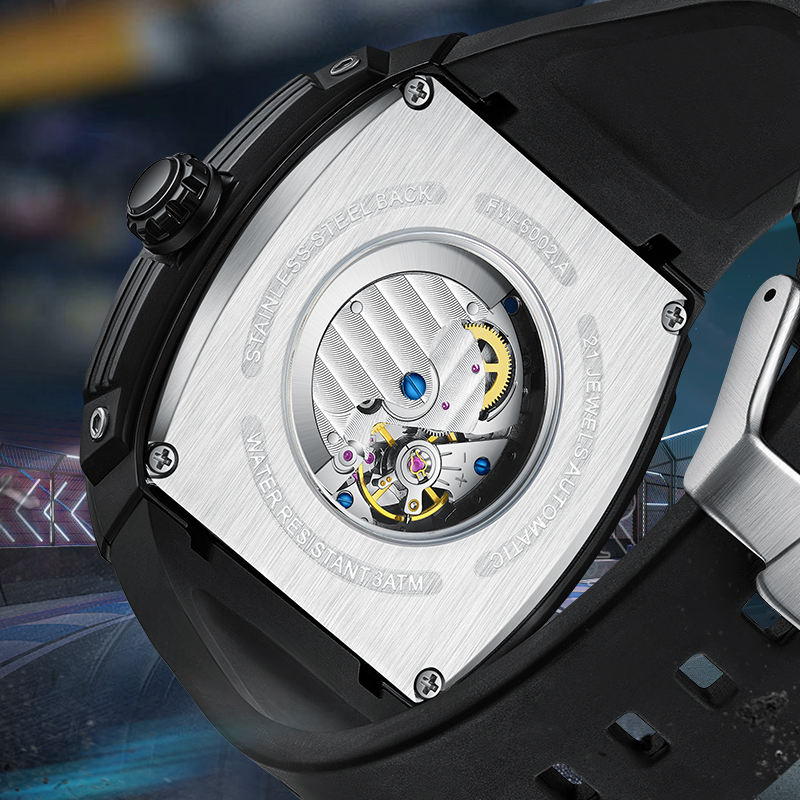 Close-up of motorsport-inspired automatic watch caseback showing exposed movement and steel back