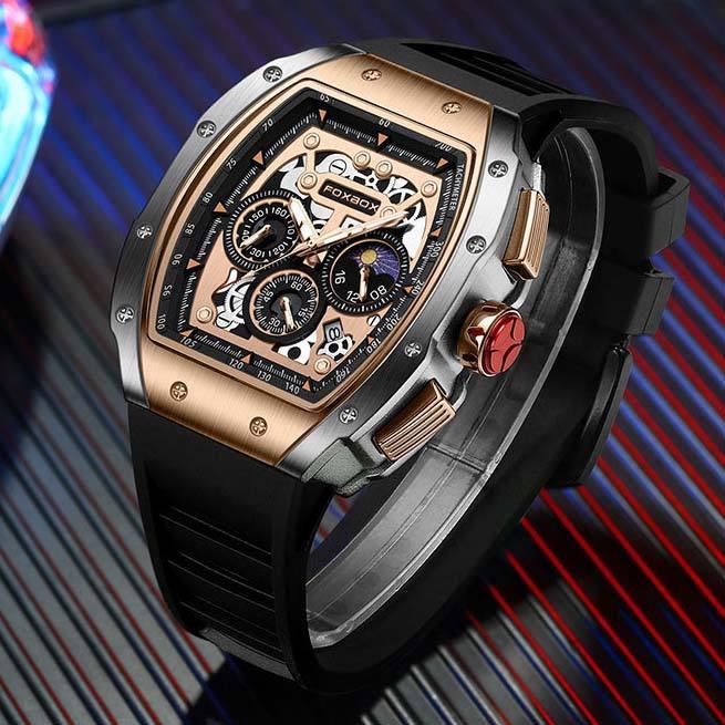 Luxury racing-inspired chronograph watch with skeleton dial, rose gold bezel, and black rubber strap