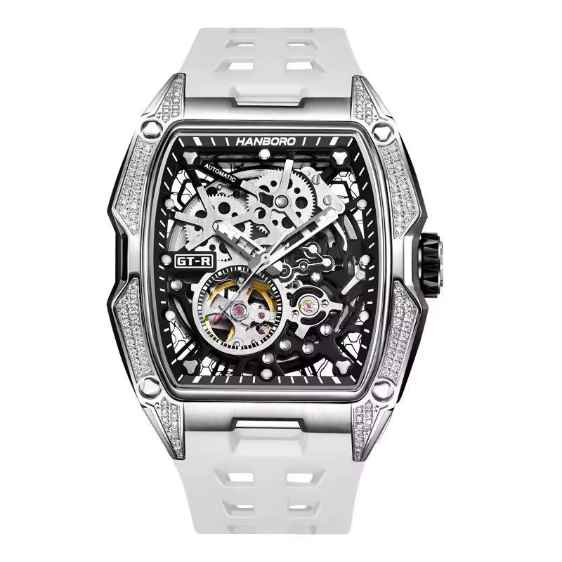 Skeleton dial luxury sport watch with tonneau case, diamond accents, and white strap