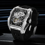 Motorsport-inspired luxury skeleton watch with tonneau case, exposed gears, black strap