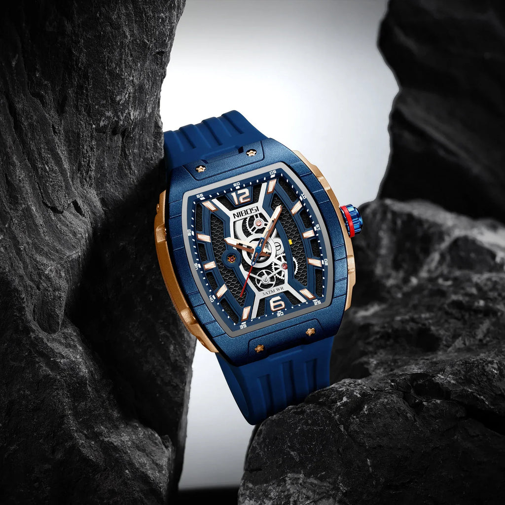 Blue and gold racing-inspired luxury watch with skeleton dial, sporty strap, bold design