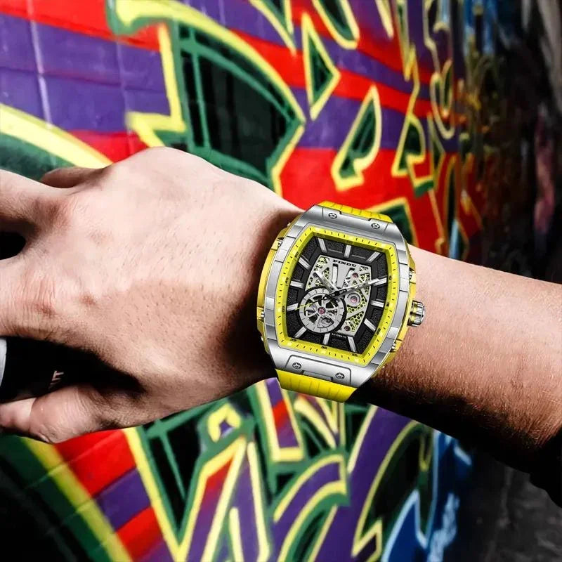 Motorsport-inspired luxury skeleton watch with yellow accents on wrist, urban graffiti background