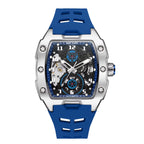 Luxury sport-inspired watch with skeleton dial, blue rubber strap, and bold stainless steel case