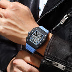 Motorsport-inspired skeleton watch with blue strap, worn with leather jacket, luxury sport style