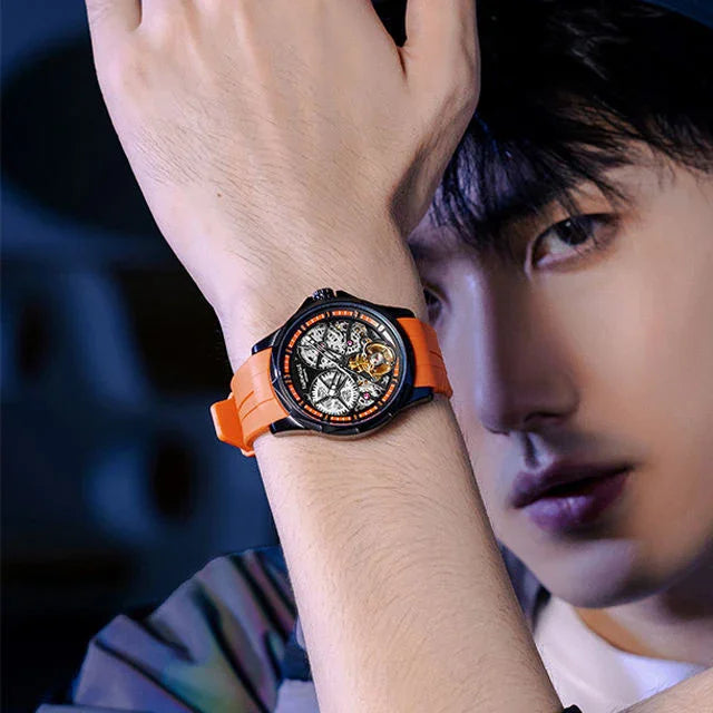 Bold sport-luxury watch with orange strap and skeleton dial inspired by European motorsport design