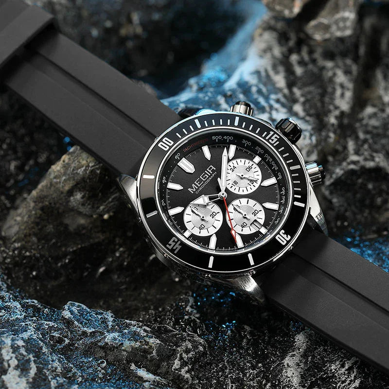 Motorsport-inspired sport-luxury chronograph watch with black bezel, bold dial, and rubber strap on a stylish textured surface