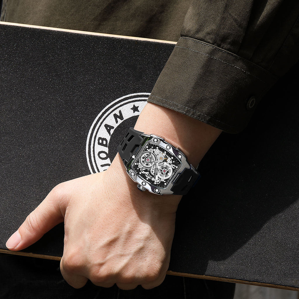Sport-luxury skeleton dial watch with black strap, inspired by motorsport design, on wrist