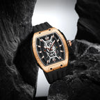 Motorsport-inspired luxury watch with rose gold case, skeleton dial, and black rubber strap