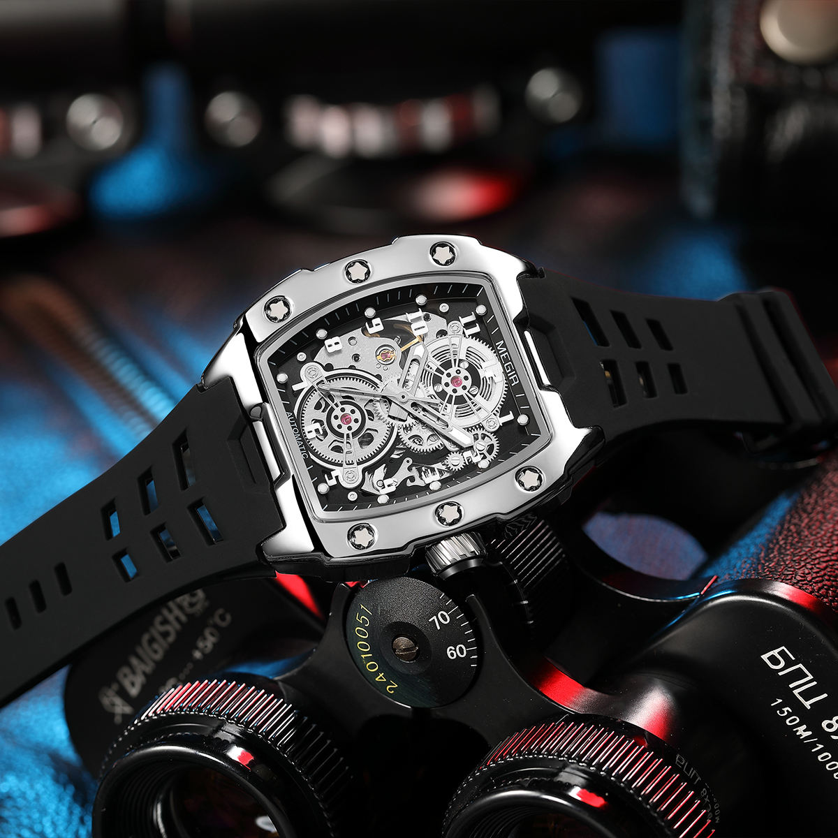 Luxury skeleton watch with bold tonneau case, visible gears, and black sport strap, motorsport-inspired design