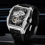Luxury racing-inspired skeleton watch with tonneau case, diamond accents, and black rubber strap
