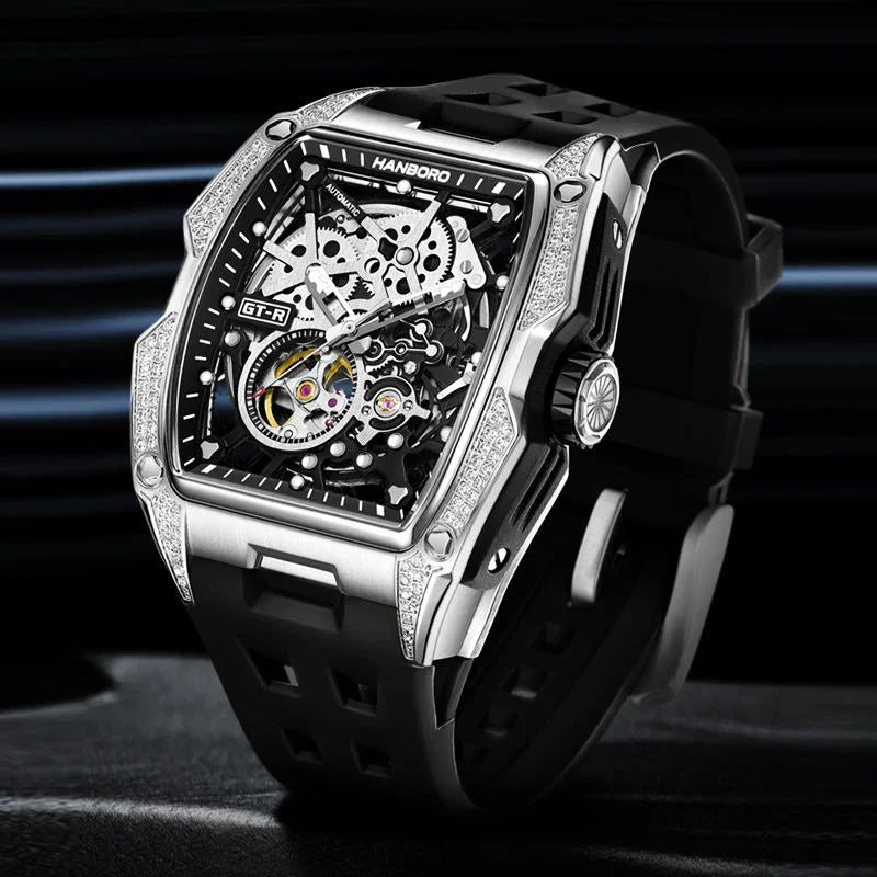 Luxury racing-inspired skeleton watch with tonneau case, diamond accents, and black rubber strap