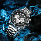 Stainless steel chronograph watch with bold motorsport-inspired design on textured rocks