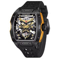 Motorsport-inspired skeleton dial watch with black case, gold accents, and rubber strap