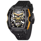 Motorsport-inspired skeleton dial watch with black case, gold accents, and rubber strap