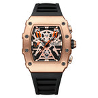 Racing-inspired rose gold chronograph watch with bold geometric dial and black rubber strap