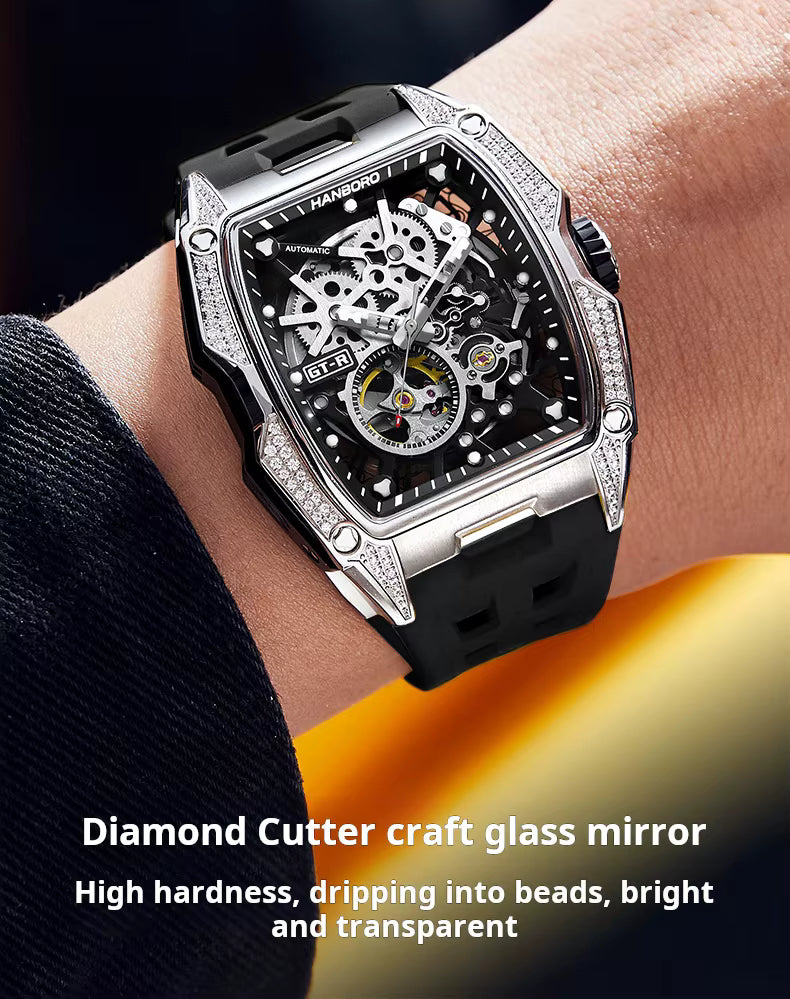Luxury racing-inspired skeleton watch with tonneau case, diamond details, and black rubber strap