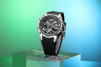 Luxury motorsport-inspired skeleton dial watch with black strap on reflective pedestal