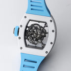 Luxury skeleton watch with visible gears, white case, and blue strap, motorsport-inspired design