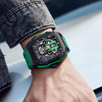 Motorsport-inspired luxury watch with green strap, bold skeleton dial, on wrist outdoors