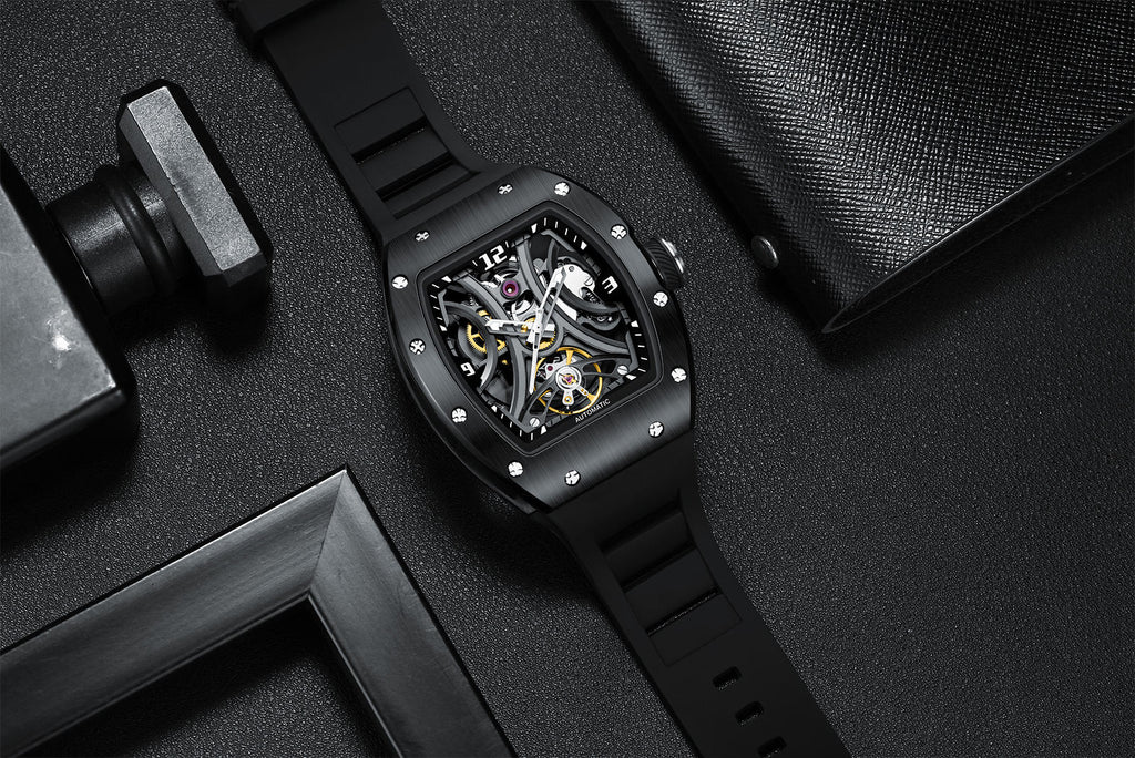Skeleton dial sport-luxury watch with black rubber strap and brushed case, motorsport-inspired design