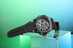 Luxury skeleton dial racing-inspired watch with black rubber strap, sporty and mechanical design