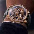 Luxury gold skeleton watch with intricate dragon design, blue dial, tourbillon, black leather strap