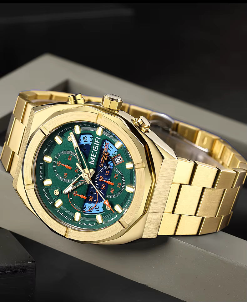 Gold motorsport-inspired watch with green and blue chronograph dial, solid bracelet, luxury sporty style