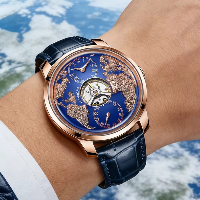 Luxury sport-inspired watch with blue dial, gold world map, and blue leather strap on wrist